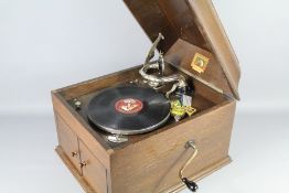 A Vintage His Master's Voice Table Gramophone and Records