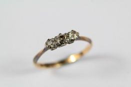 An Antique 18ct and Platinum Three Stone Old-Cut Diamond Ring