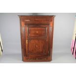 An Antique Oak Corner Cabinet