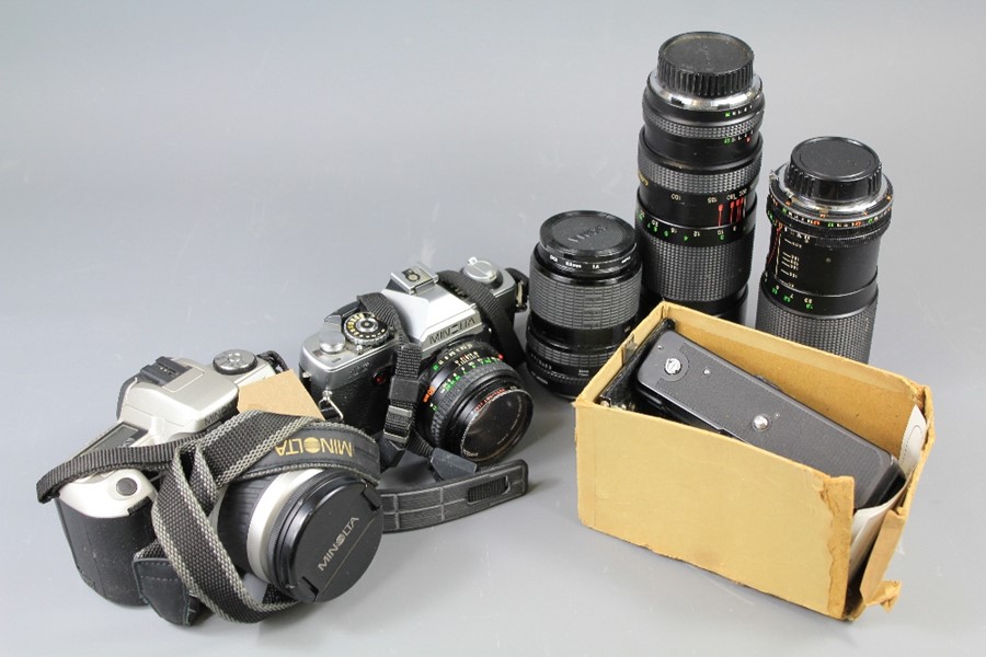 Two Minolta 35 mm SLR Cameras