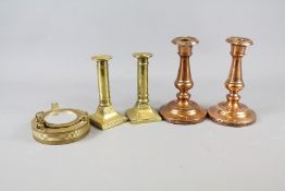 A Pair of Copper Candlesticks