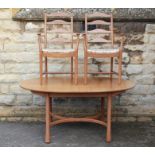 A Light Oak Ercol Oval Dining Table