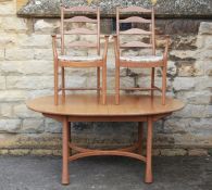 A Light Oak Ercol Oval Dining Table