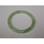 A Chinese Apple Green Jade-Style Bangle