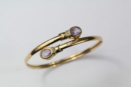 A Gold Amethyst and Diamond Bangle