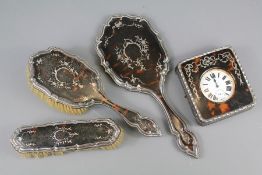 A Silver and Tortoiseshell Dressing Table Set
