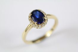 A 14ct Yellow Gold Synthetic Sapphire and CZ Ring