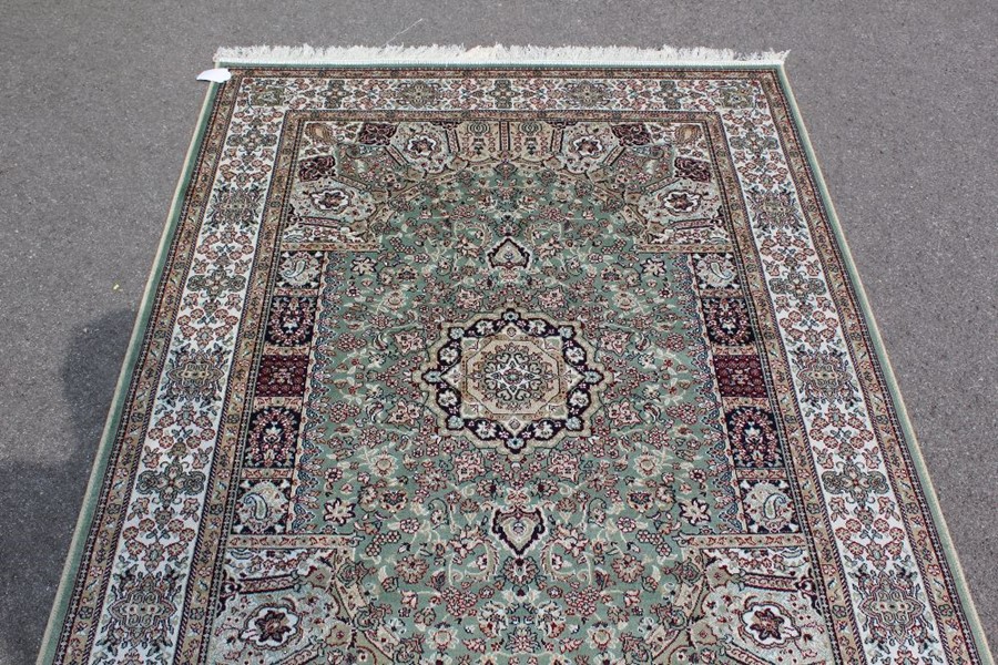 A Green Ground Keshan Rug