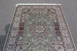 A Green Ground Keshan Rug