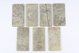 Seven Chinese Silver-Metal Tokens