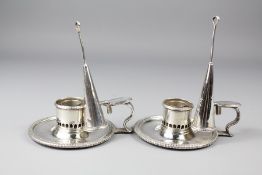 A Pair of George III Circular Chamber Candlesticks