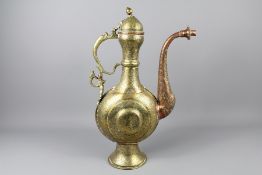 A 19th Century Islamic Bronze and Copper Ewer