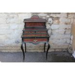 A Louis XV Style Ebonised and Burr Walnut Desk