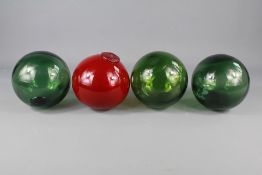 Four Glass Paperweights
