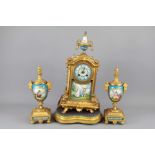 A 20th Century French Brass and Enamel Clock and Garniture