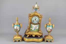 A 20th Century French Brass and Enamel Clock and Garniture