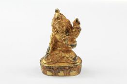 A Tibetan Gilt Bronze Figure of Buddha