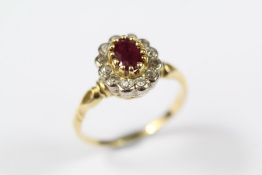 An 18ct Yellow Gold Ruby and Diamond Cluster Ring