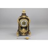 A 19th Century French Ebony and Ormolu Mantel Clock