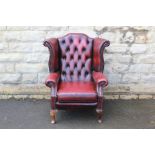 A Claret Leather Button Back Wing-back Chair