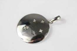 A Silver and Diamond Disc Pendant