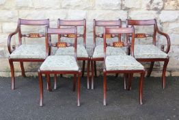 A Set of Six Dining Chairs