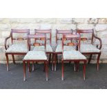 A Set of Six Dining Chairs