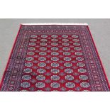 A Red Ground Bokhara Carpet