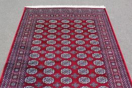 A Red Ground Bokhara Carpet