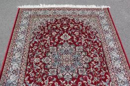 A Red Ground Keshan Rug