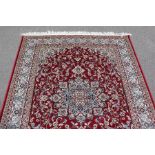 A Red Ground Keshan Rug