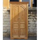 A Large Scubbed Pine Corner Cupboard