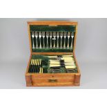 An Edwardian Oak Cased Silver Plated Canteen of Cutlery