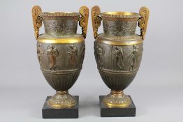 A Pair of Bronze Urns