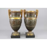 A Pair of Bronze Urns