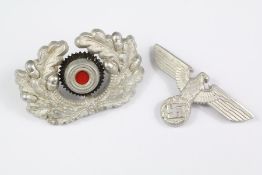 Two German WWII Era Cap Badges