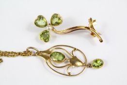 An Antique 14 ct Gold Peridot Seed Pearl Floral Pendant