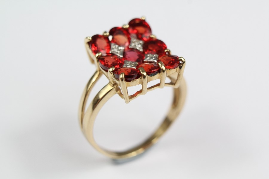 A 9ct Gold Diamond and Spinel Ring