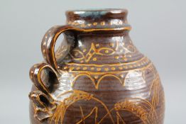 A Large Brown Glazed Harvest Jug