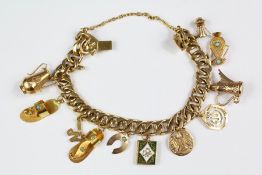 A Middle Eastern 14ct Yellow Gold Charm Bracelet