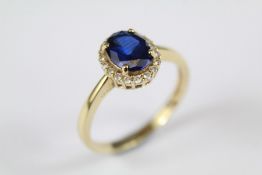 A 14ct Yellow Gold Synthetic Sapphire and CZ Ring