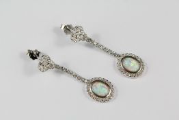 A Pair of Silver CZ and Opal Earrings