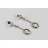 A Pair of Silver CZ and Opal Earrings