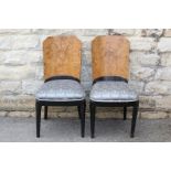 A Pair of Art Deco Walnut and Ebonized Chairs