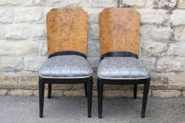 A Pair of Art Deco Walnut and Ebonized Chairs