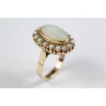 A Lady's 14ct Opal and Pearl Cluster Ring.