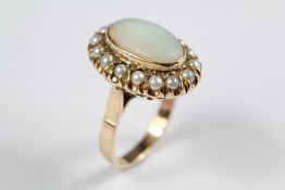 A Lady's 14ct Opal and Pearl Cluster Ring.