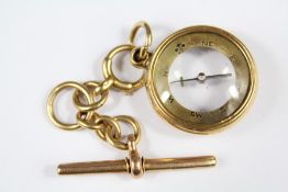 A 18ct Gold Encased Compass and Fob