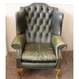 A Green Leather Wing-back Arm Chair