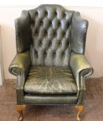 A Green Leather Wing-back Arm Chair